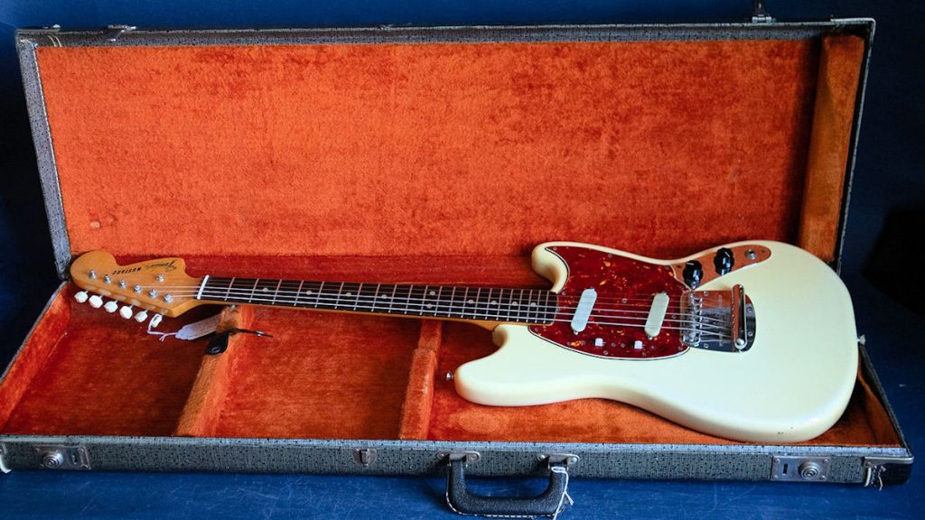 1965 Fender Mustang guitar. Olympic white with tortoiseshell pick guard