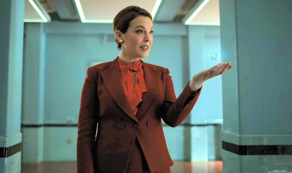 Jane Hancock as the “orientation woman” for soon-to-be-released Alcatraz prisoners. - Altered Carbon 101