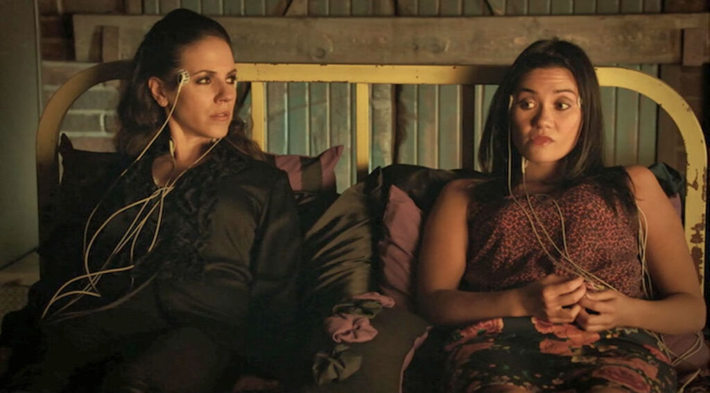 Anna Silk as Bo and Vanessa Matsui as Cassie, preparing to enter Dyson's mind - Lost Girl 407