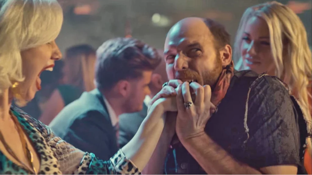Red (David Haysom) takes a bite out of his date, played by Millie Jayne - Wynonna Earp 102