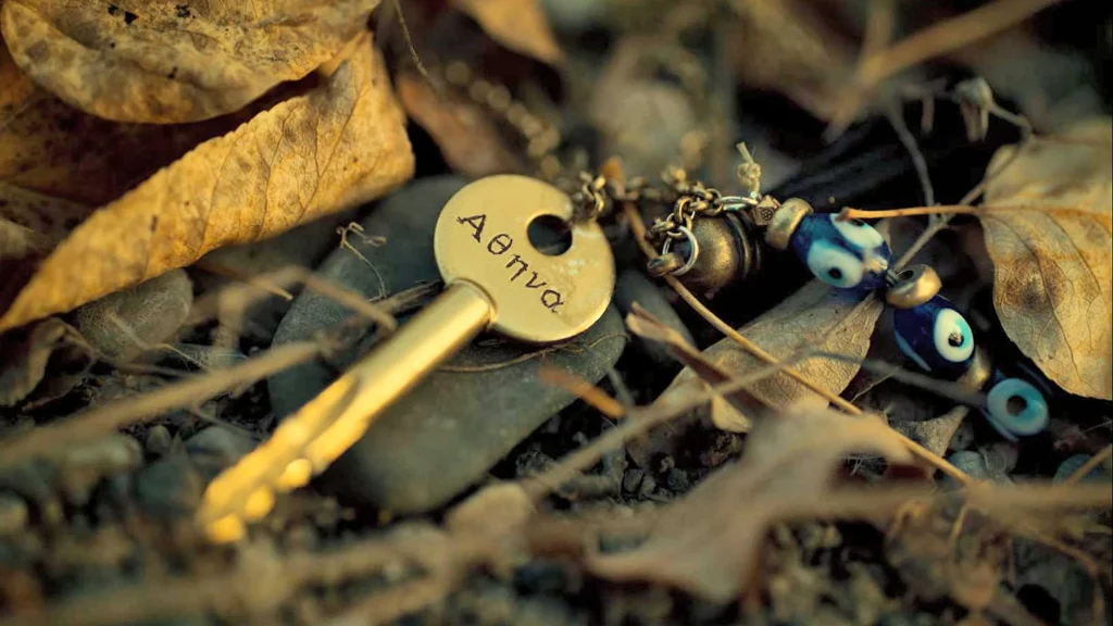 Wynonna's necklace with "Athena" inscribed on the key.