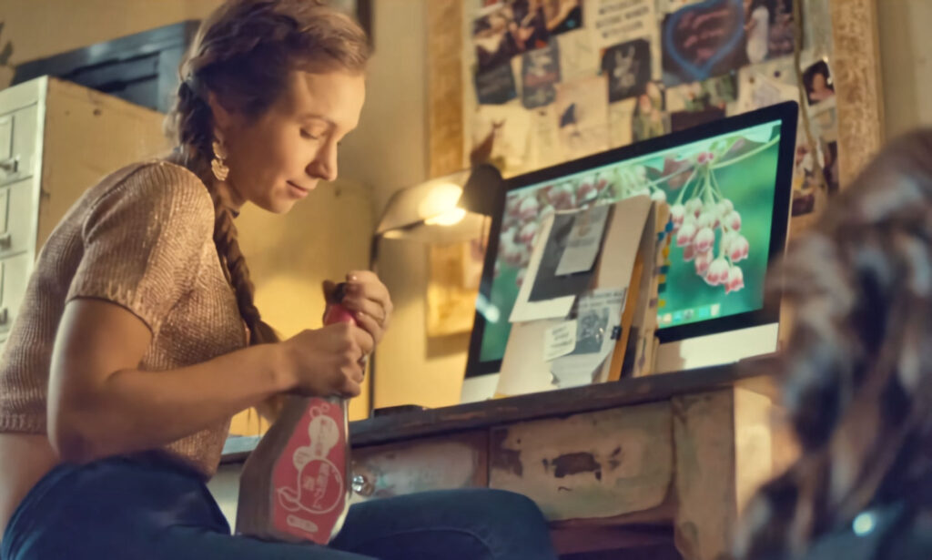 Dominique Provost-Chalkley as Waverly with her Bubblegum Saki. Her computer wallpaper is lillies of the valley.. - Wynonna Earp 104