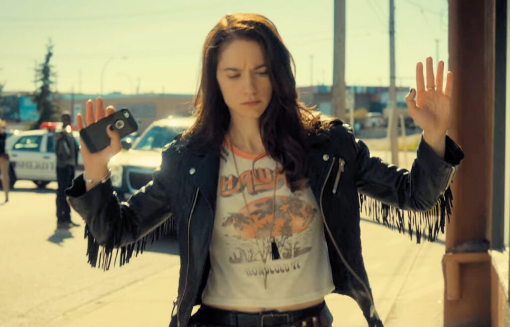 Wynonna (Melanie Scrofano) gives herself up in exchange for the release of hostages. - Wynonna Earp 103