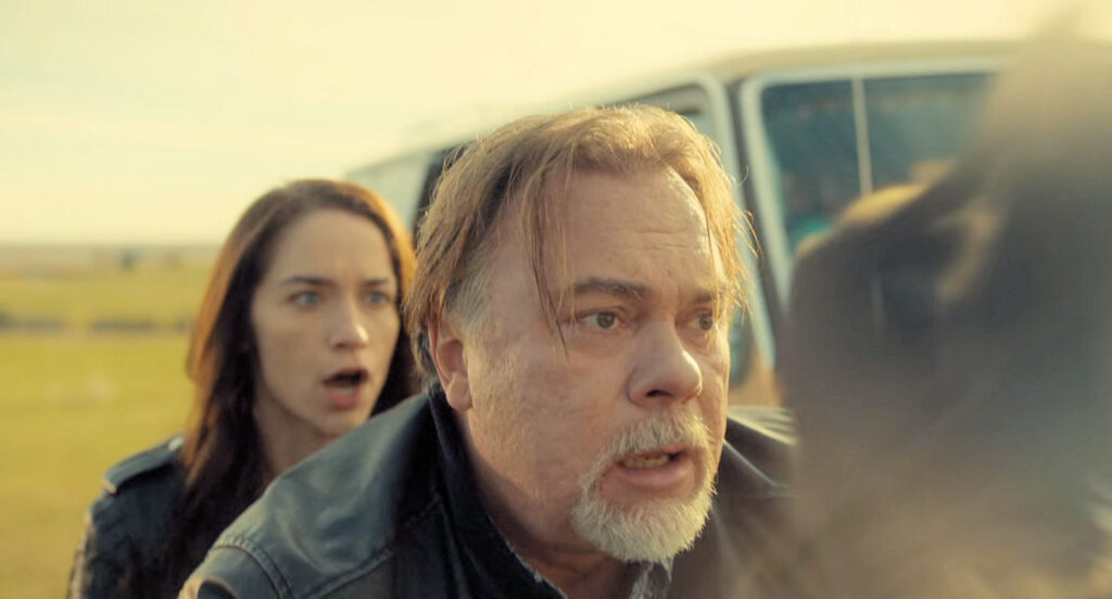 Shorty (Peter Skagen) prepares to inhale the smoky spirit of a revenant to protect Wynonna. - Wynonna Earp 103