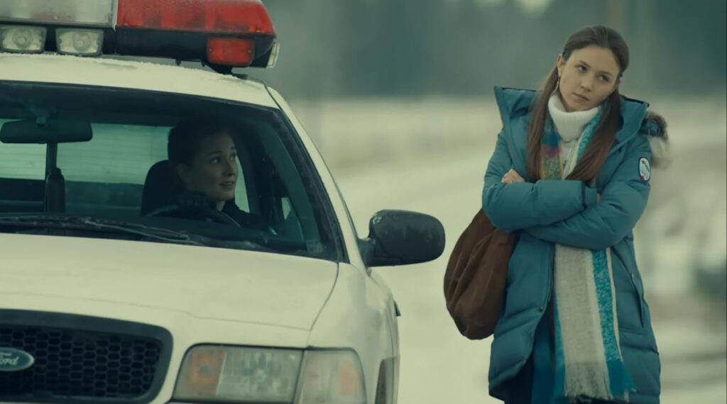 Kat Barrell as Nicole Haught talking to Waverly (Dominique Provost-Chalkley) from her squad car - Wynonna Earp