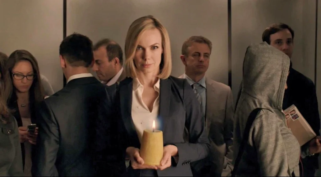 Amanda Walsh as an unnamed lawyer with candle - Lost Girl 502