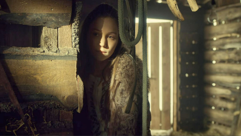 Waverly (Dominique Provost-Chalkley) peers from the shadows as she listens to Willa and Wynonna talk in the barn - Wynonna Earp 111