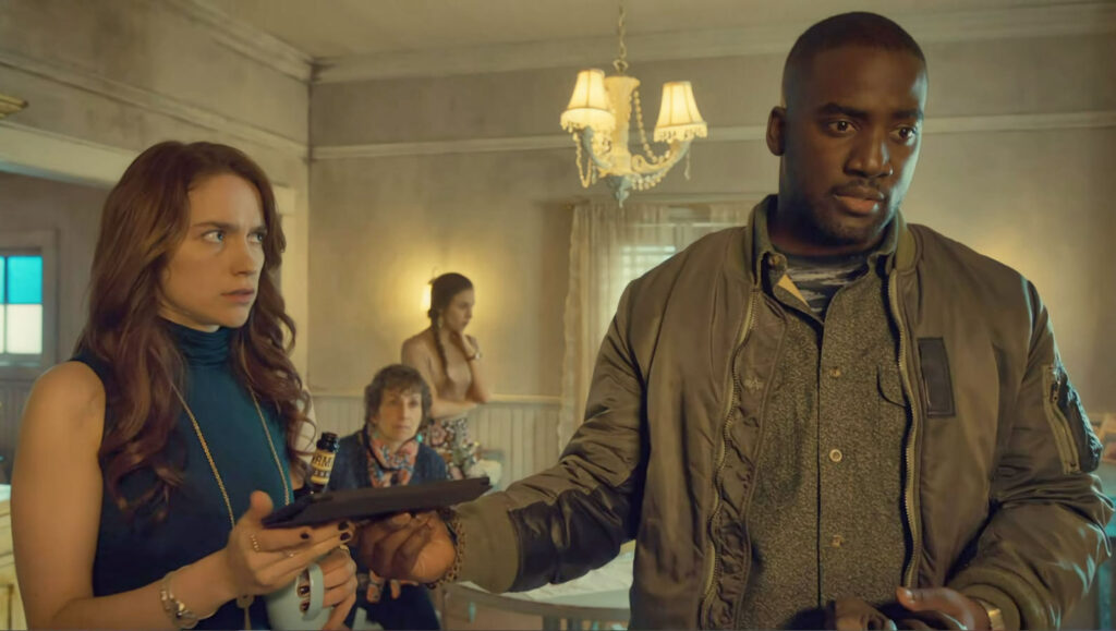 Dolls (Shamier Anderson) hands Wynonna (Melanie Scrofano) the DNA results - Wynonna Earp 111