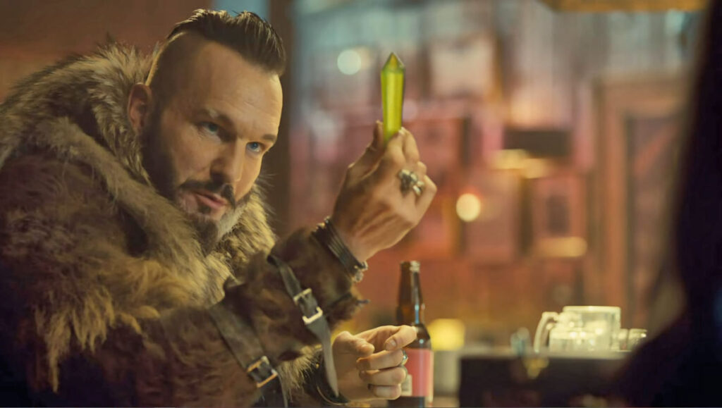 Michael Eklund as Bobo, examining a crystal delivered to him by Judge Cryderman - Wynonna Earp