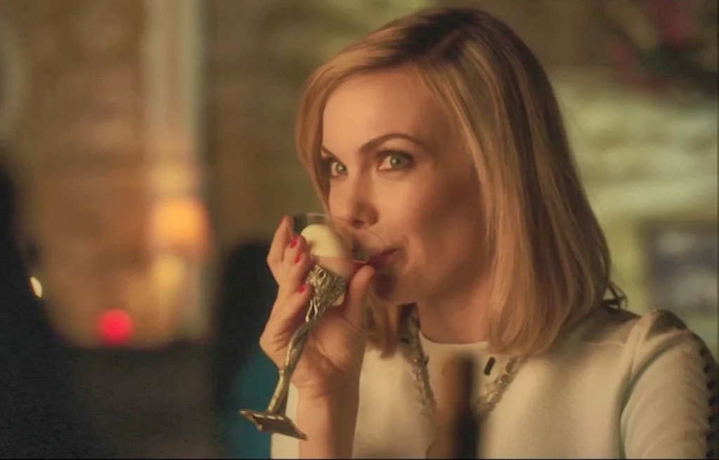 Amanda Walsh as Zee at the Dal sipping a drink - Lost Girl 506