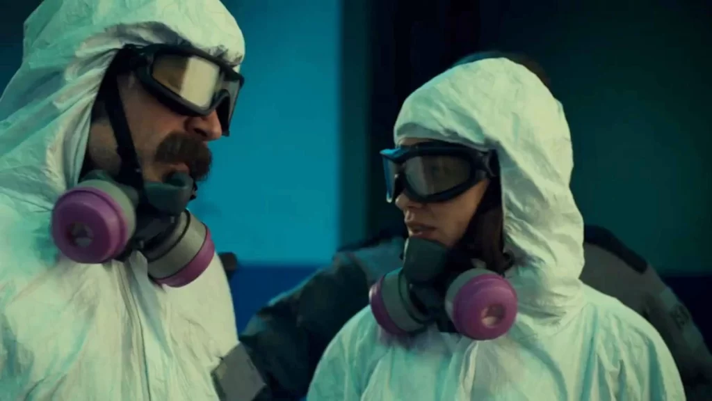 Doc and Wynonna in hazmat suits disguised as Black Badge cleaners. - Wynonna Earp 201