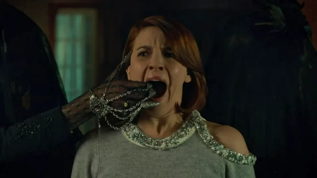 Dani Kind as Mercedes Gardner - a hand wearing a finger glove reaches into her mouth - Wynonna Earp 203