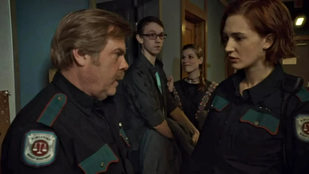 Kat Barrell as Officer Nicole Haught, Greg Lawson as Sheriff Nedley, with Beth Gardner (Meghan Heffern,) and Tucker Gardner (Caleb Ellsworth-Clark) in the background - Wynonna Earp 203