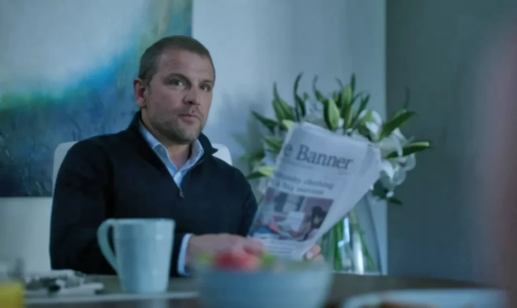 David Cubitt as Ted Pownall with newspaper - Siren 103