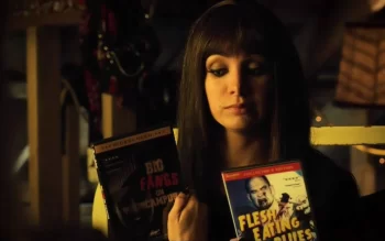 Kenzi (Ksenia Solo) tries to decide between zombie flicks. - Lost Girl 411
