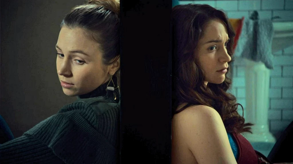 Waverly (Dominique Provost-Chalkley) and Wynonna (Melanie Scrofano) have a talk through a closed bathroom door. - Wynonna Earp - 205