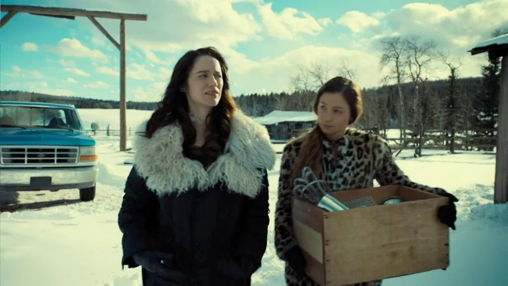 Wynonna (Melanie Scrofano) and Waverly (Dominique Provost-Chalkley) moving the shiny things that Waverly collected when she was possessed by a demon.