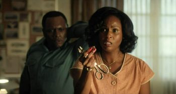 Khalilah Joy as Valerie Mann showing Hynek and Quinn the metal disc she dug out of her husband's neck - Project Blue Book 109