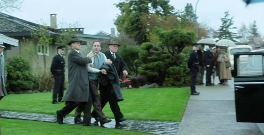 Donna's husband Jack (Kurt Evans) being led away by FBi agents - Project Blue Book 110