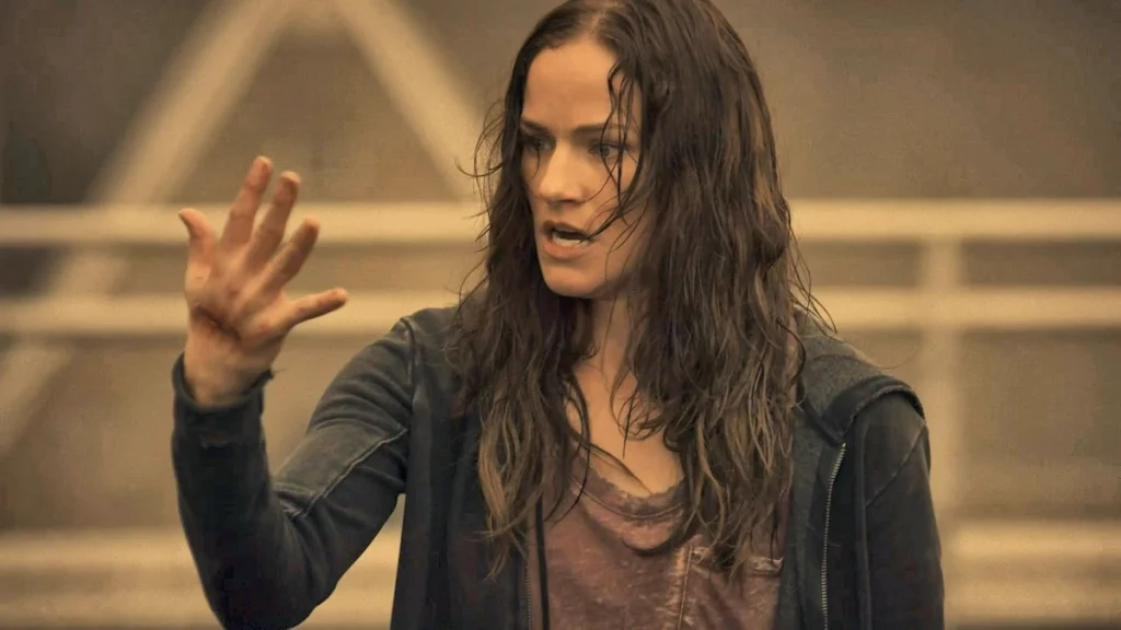 Vanessa (Kelly Overton) watches the wound on her hand heal - Van Helsing 101