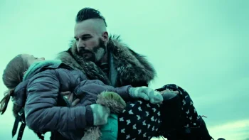 Bobo Del Rey (Michael Eklund) carries young Waverly (Summer McBrien) after rescuing her from the icy lake - Wynonna Earp 208