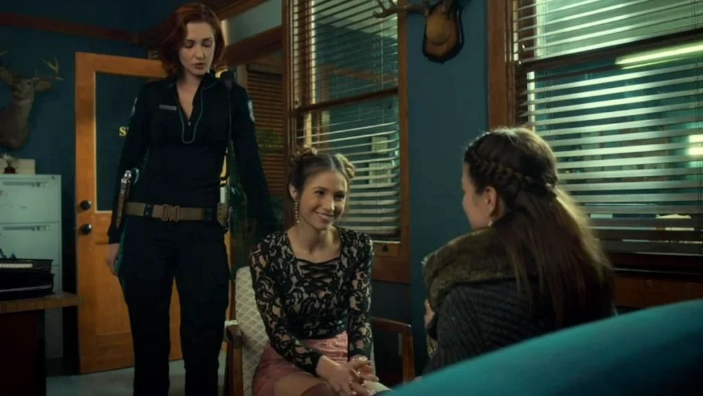 Nicole Haught (Kat Barrell) looks on disapprovingly as Waverly and Beth flirt - Wynonna Earp 209