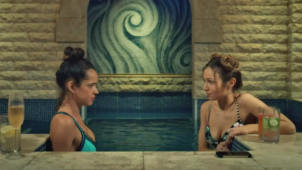 Rosita (Tamara Duarte) and Waverly (Dominique Provost-Chalkley) in a hot tub with champagne - Wynonna Earp 209