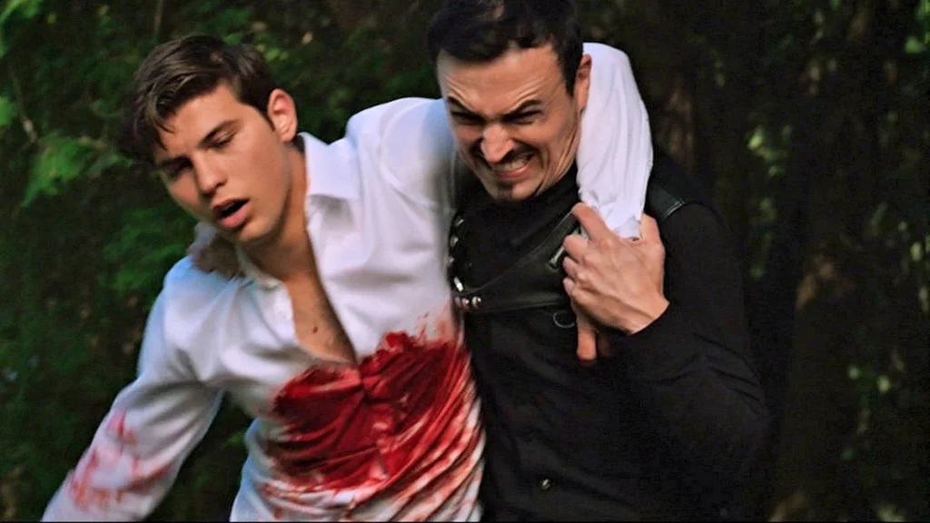 Vex (Paul Amos) helps the wounded Mark (Luke Bilyk) - Lost Girl 508