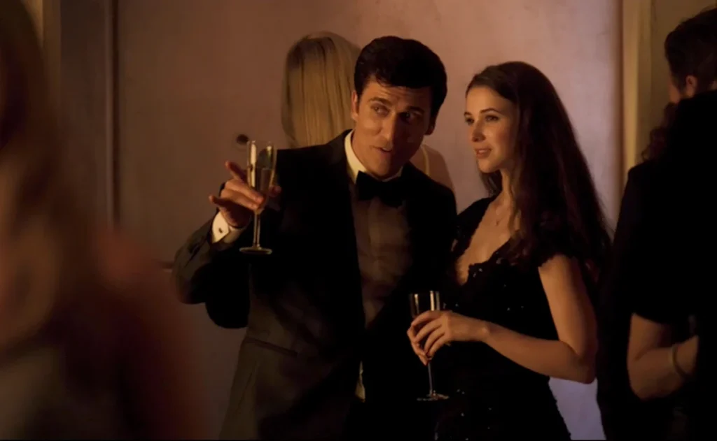 Hera (Noam Jenkins) with unnamed woman at party. - Lost Girl 508