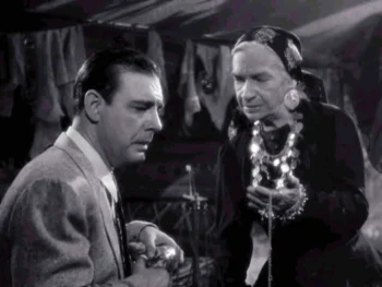 Maria Ouspenskaya as Maleva and Claude Rains as Sir John Talbot - The Wolf Man